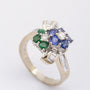 White gold bow ring with sapphire, emerald and diamonds