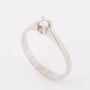 White gold solitaire ring with a 0.14 ct brilliant.