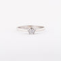 White gold solitaire ring with a 0.14 ct brilliant.