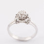 White gold entourage ring with 7 brilliant-cut diamonds. Approx. 0.24 ct.