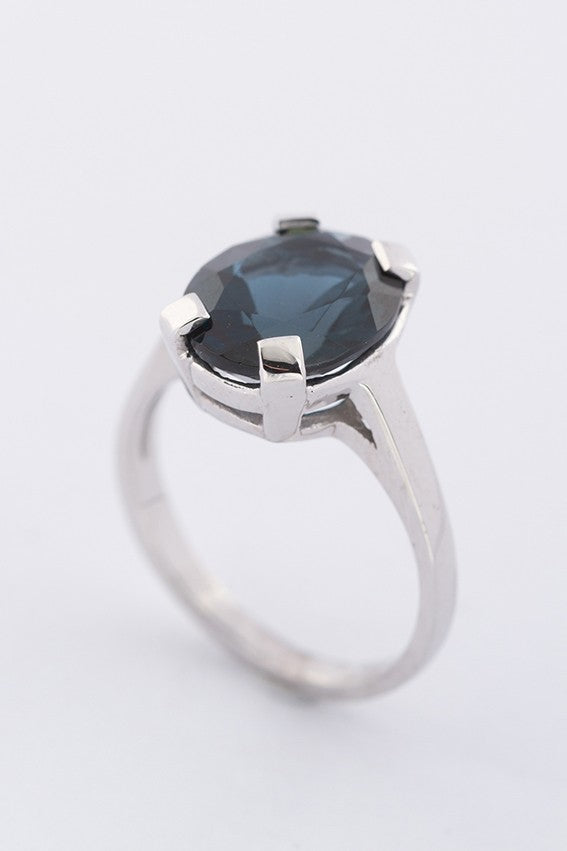 White gold ring with a topaz