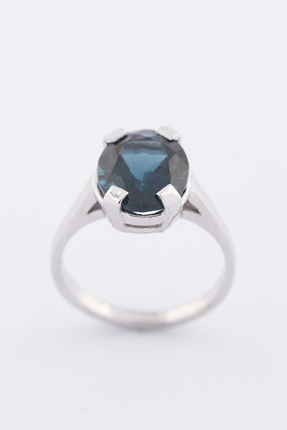 White gold ring with a topaz