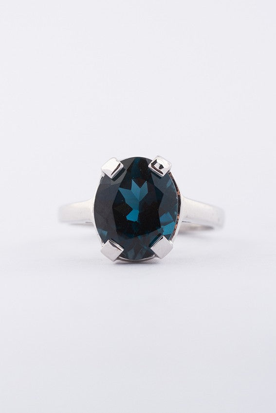 White gold ring with a topaz