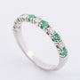 White gold row ring with 6 emeralds and 5 brilliants