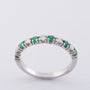 White gold row ring with 6 emeralds and 5 brilliants