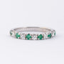 White gold row ring with 6 emeralds and 5 brilliants