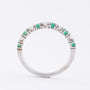 White gold row ring with 6 emeralds and 5 brilliants