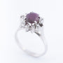 White gold entourage ring with ruby ​​and diamonds