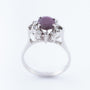 White gold entourage ring with ruby ​​and diamonds