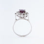 White gold entourage ring with ruby ​​and diamonds