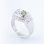 White block ring with a peridot and diamonds