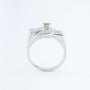 White block ring with a peridot and diamonds