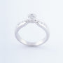 White gold ring with a brilliant and princess cut diamonds