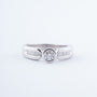 White gold ring with a brilliant and princess cut diamonds