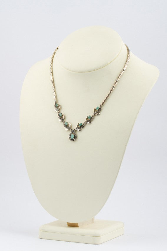 Zilveren parure met smaragden en markasiet