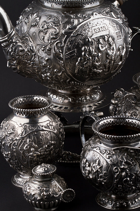 Silver tableware with old Dutch scene