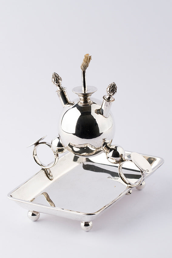 Antique silver flame holder